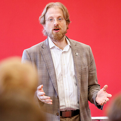 Gus Hurwitz Presenting Image