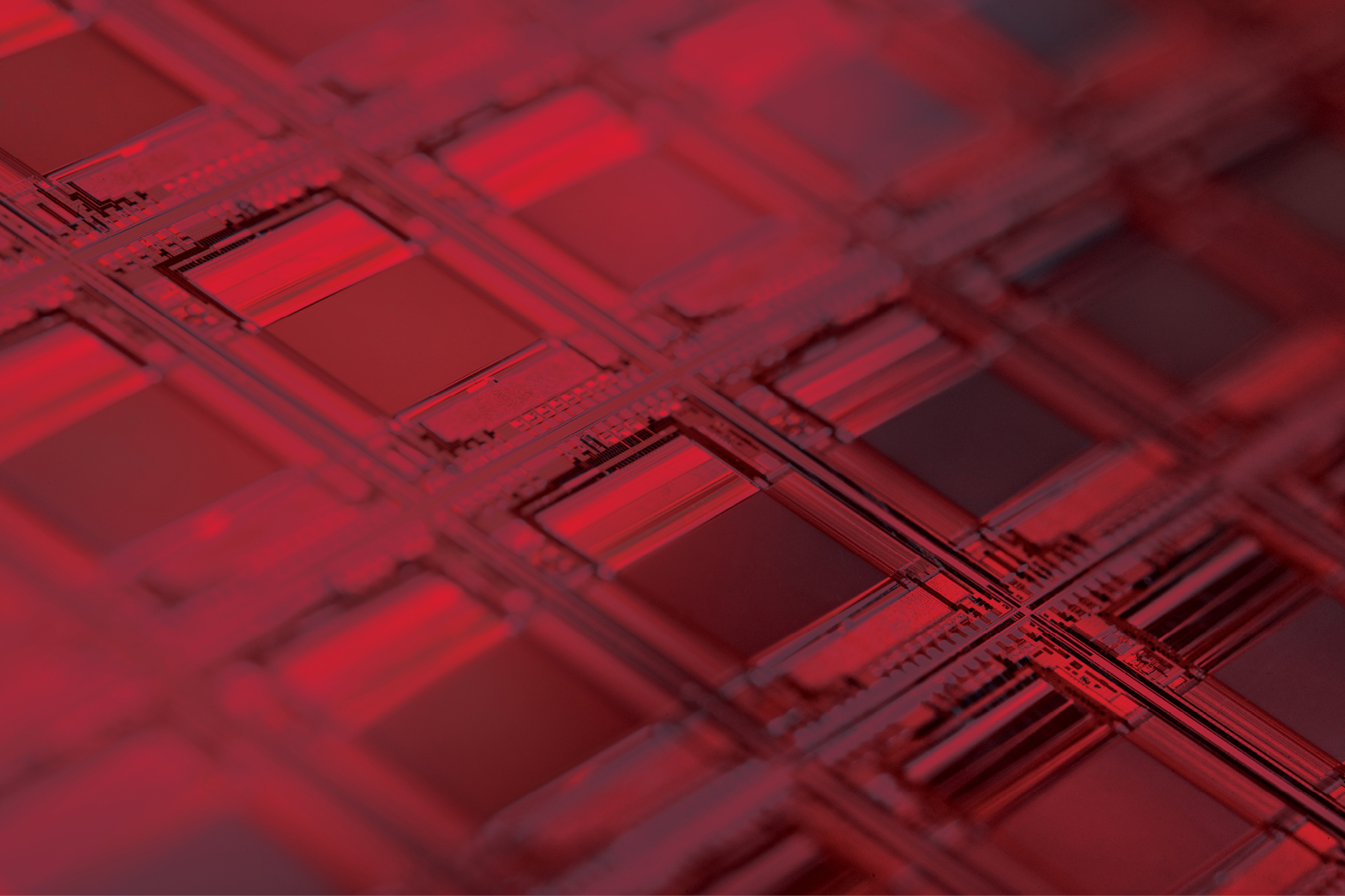 a row of computer wafers with a red overlay